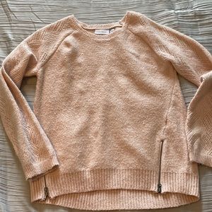 Soft pink sweater with zipper detail